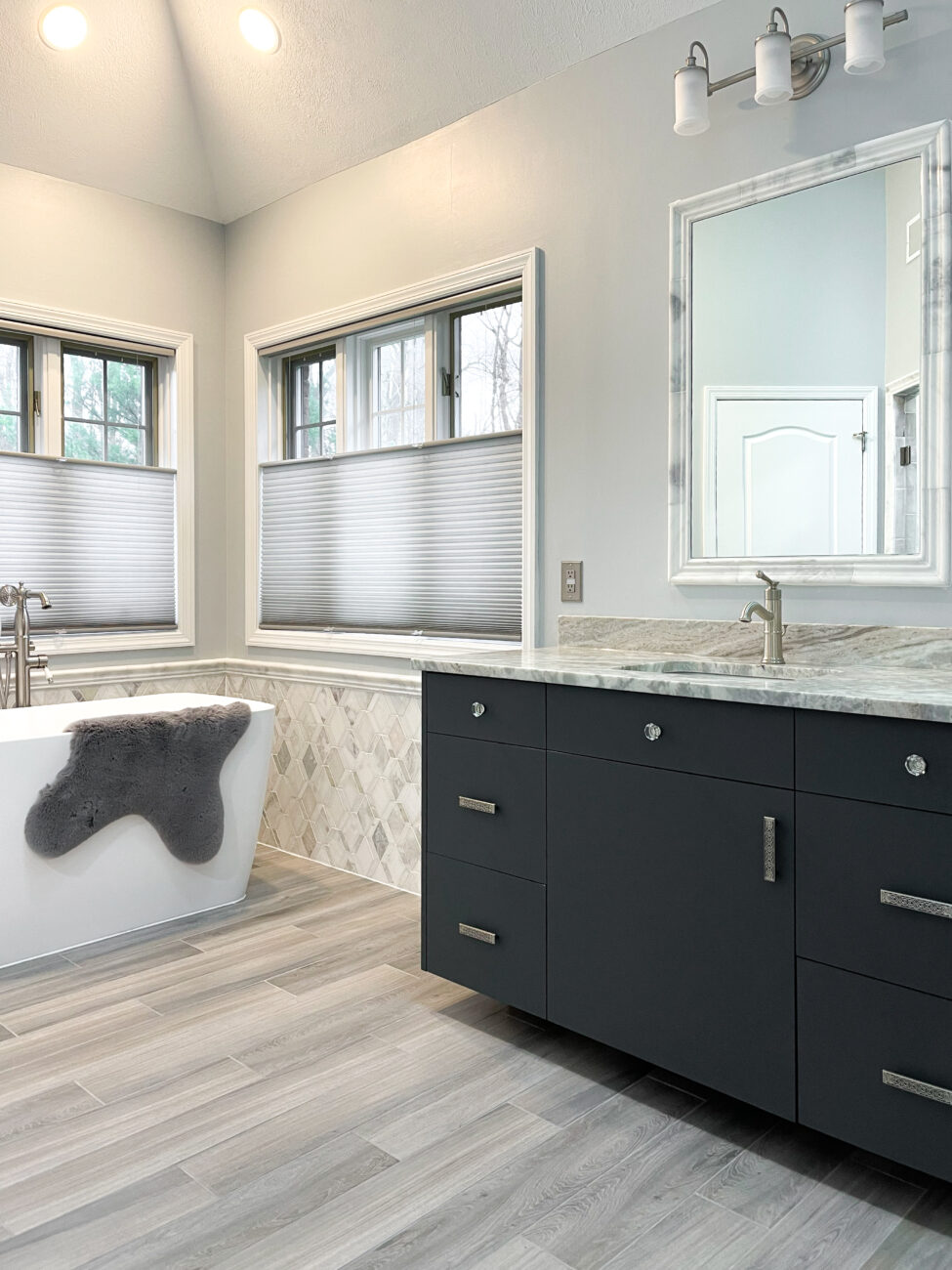 Carbon Grey frameless vanity cabinets with slab doors and drawer fronts